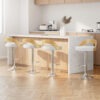 Artiss White Leather Adjustable Bar Stools set of four around a modern kitchen island