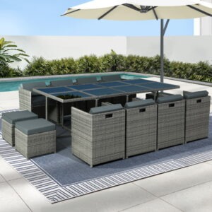 Gardeon 13-piece wicker outdoor dining set with grey cushions on a contemporary patio