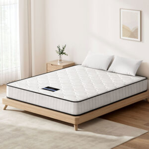 Giselle Bedding Queen 21cm tight top mattress displaying its modern quilted white surface fabric on a bed frame.