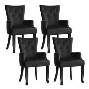 Artiss velvet french provincial dining chairs black set of four arranged neatly around a wooden dining table.